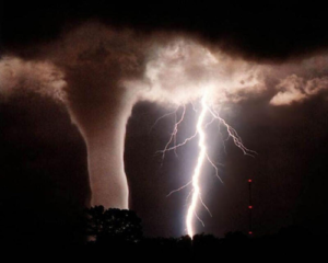 Tornadoes are spun out from huge clouds that also create lightning. Image Credit: NASA JPL
