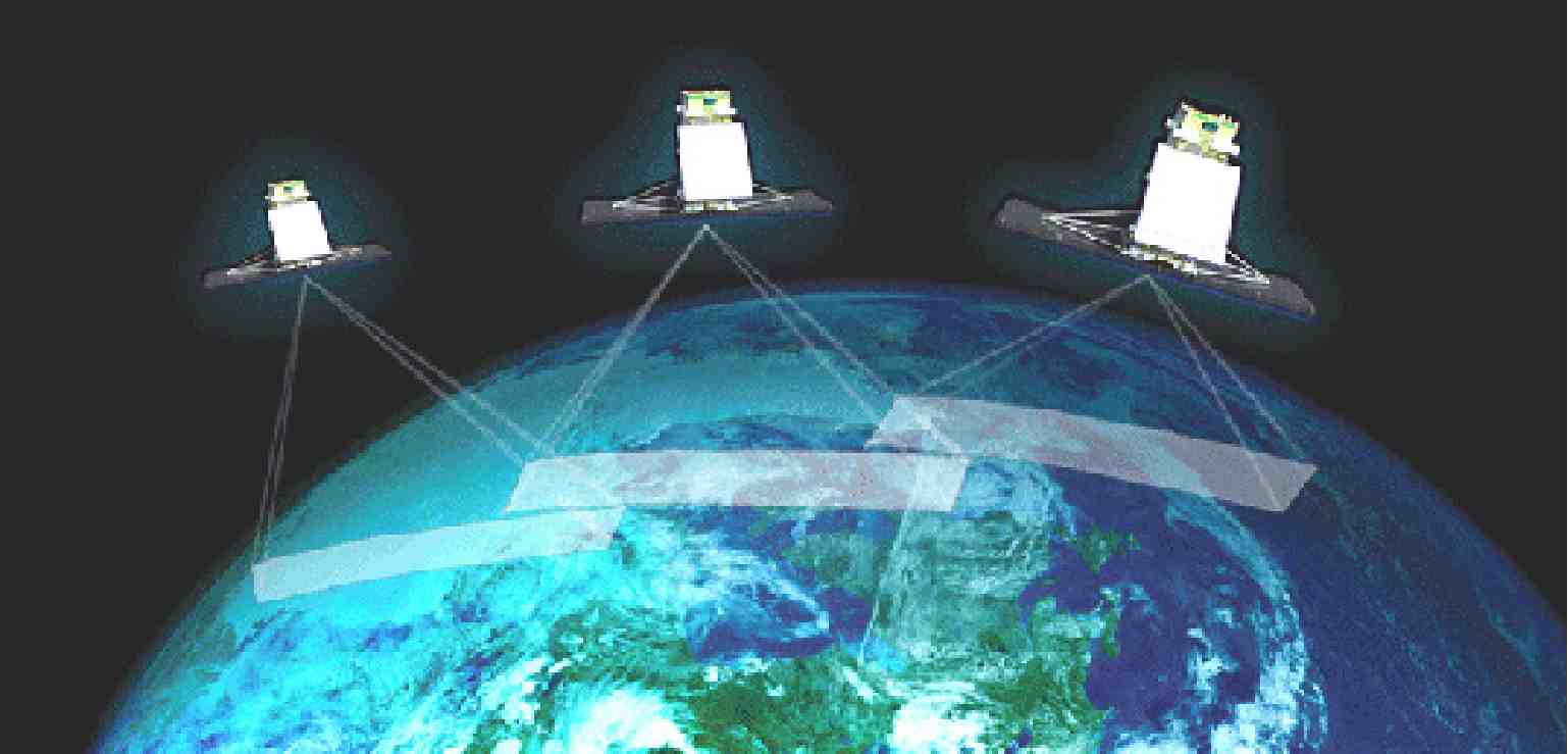 Artists rendition of three RADARSAT Constellation satellites observing the earth from space.