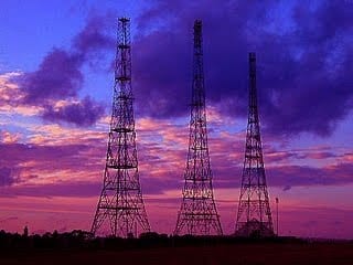 Image of power lines against a purple sky 
