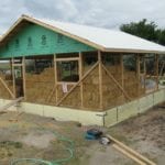 Cropped image of a straw bale house under construction