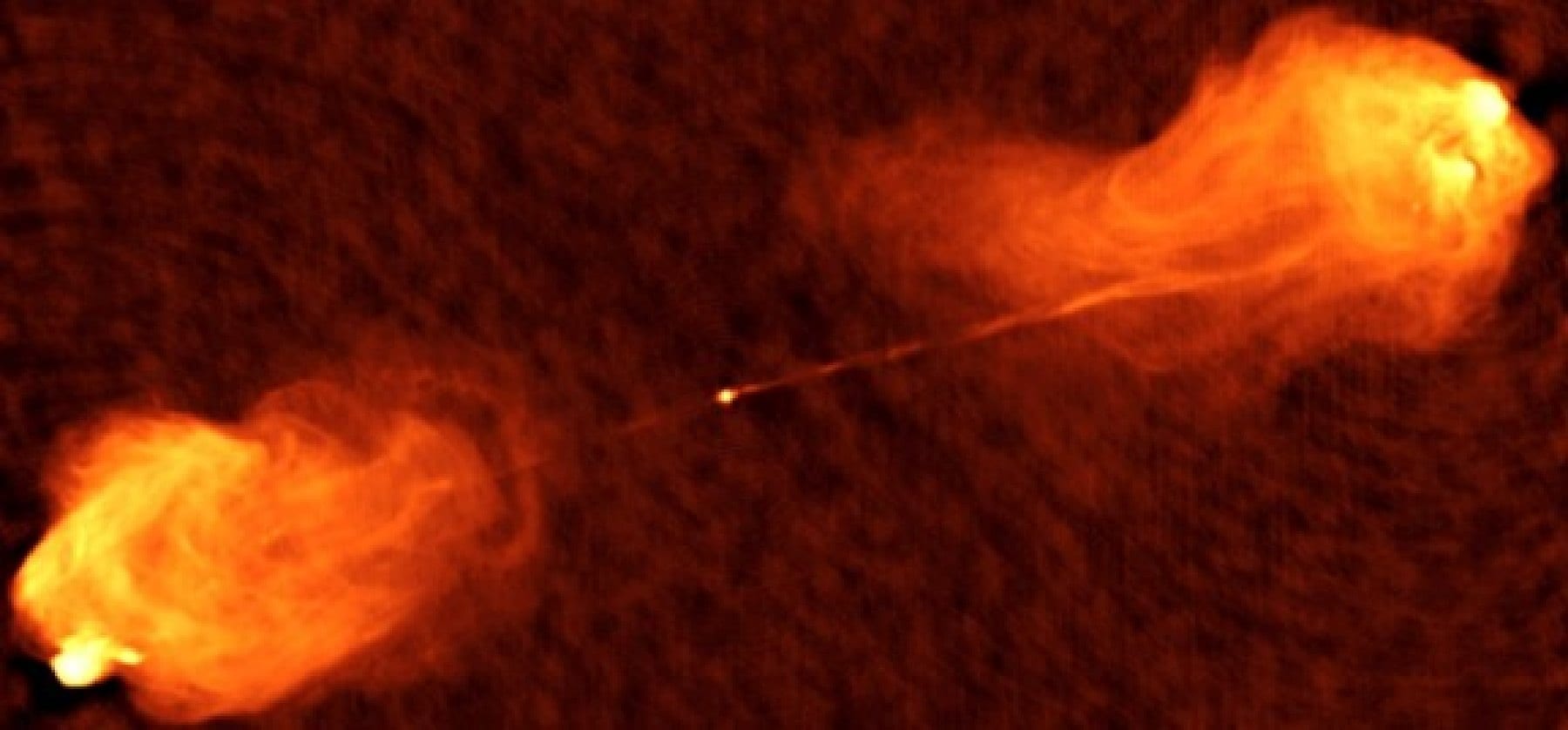 Figure 2. A radio image of the nucleus, jets, and outer lobes of the radio galaxy Cygnus A. The plasma jets are approximately 500,000 light years across, or over 5 times the size of our Milky Way galaxy (image courtesy NRAO).