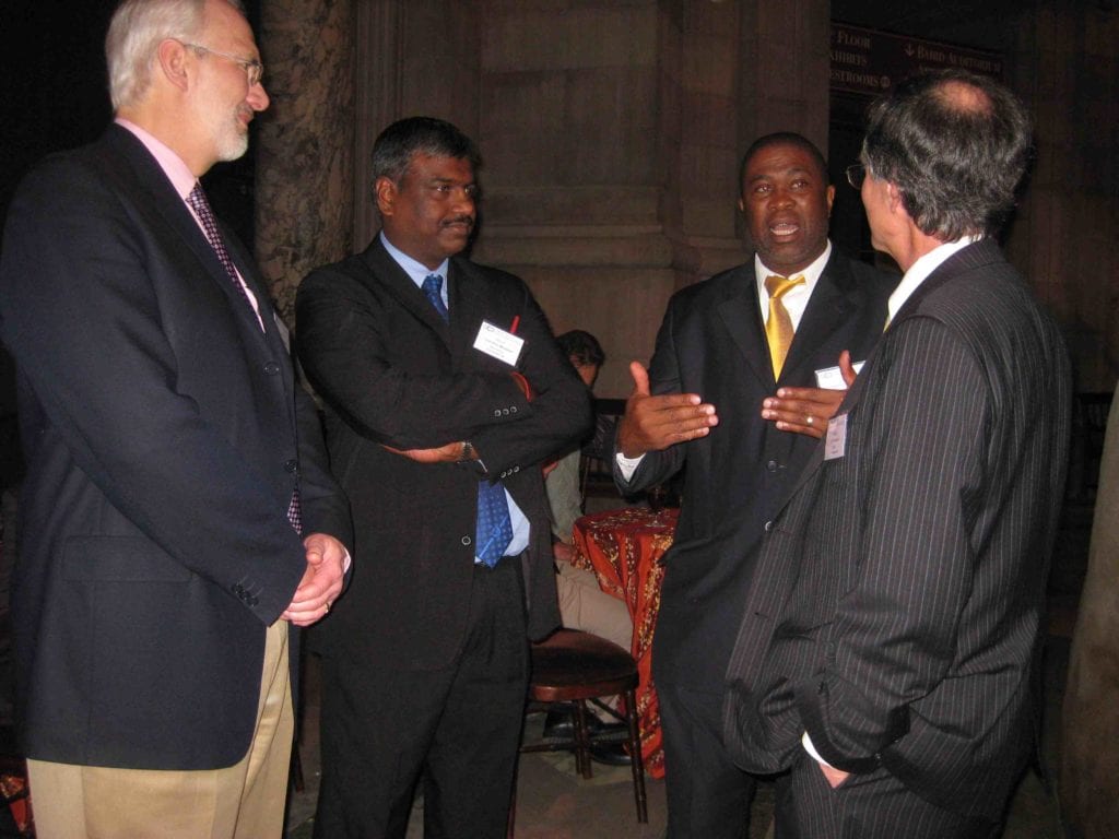 Dr. Mjwara (2nd from right) describing new developments in South Africa to Ellsworth LeDrew, Val Munsami, and Jay Pearlman (left to right).
