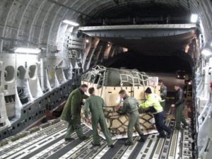 A multinational aircrew from the Heavy Airlift Wing out of Papa Air Base, Hungary, loads a C-17 Globemaster III with aid supplies and equipment coming out of Orebro, Sweden, for its second mission to Port-au-Prince, Haiti. The first load of materials was delivered Jan. 18, 2010, to Port-au-Prince's main airport. The air relief is being delivered in response to a massive earthquake that struck Haiti Jan. 12, 2010. This is the first humanitarian assistance operation flown by the Heavy Airlift Wing since it stood up in July 2009. The wing is a multinational force made up of airmen from 12 nations. (U.S. Air Force photo/ Staff Sgt. Michael T. McCool