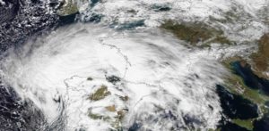 Climate Experienced and Observed - An extratropical cyclone named Xynthia brought hurricane-force winds and high waves to Western Europe at the end of February 2010, CNN reported. Winds as fast as 200 kilometers (125 miles) per hour reached as far inland as Paris, and at the storm's peak, hurricane-force winds extended from Portugal to the Netherlands. Hundreds of people had to take refuge from rising waters on their rooftops. By March 1, at least 58 people had died, some of them struck by falling trees. Most of the deaths occurred in France, but the storm also caused casualties in England, Germany, Belgium, Spain, and Portugal. The Moderate Resolution Imaging Spectroradiometer (MODIS) on NASA's Aqua satellite captured this image of Western Europe, acquired in two separate overpasses on February 27, 2010. MODIS captured the eastern half of the image around 10:50 UTC, and the western half about 12:30 UTC. Forming a giant comma shape, clouds stretch from the Atlantic Ocean to northern Italy. This image has a resolution of 1 kilometer.