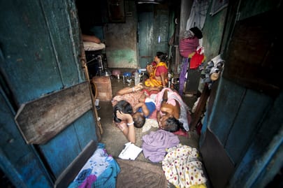 Photo of a family living in a shack