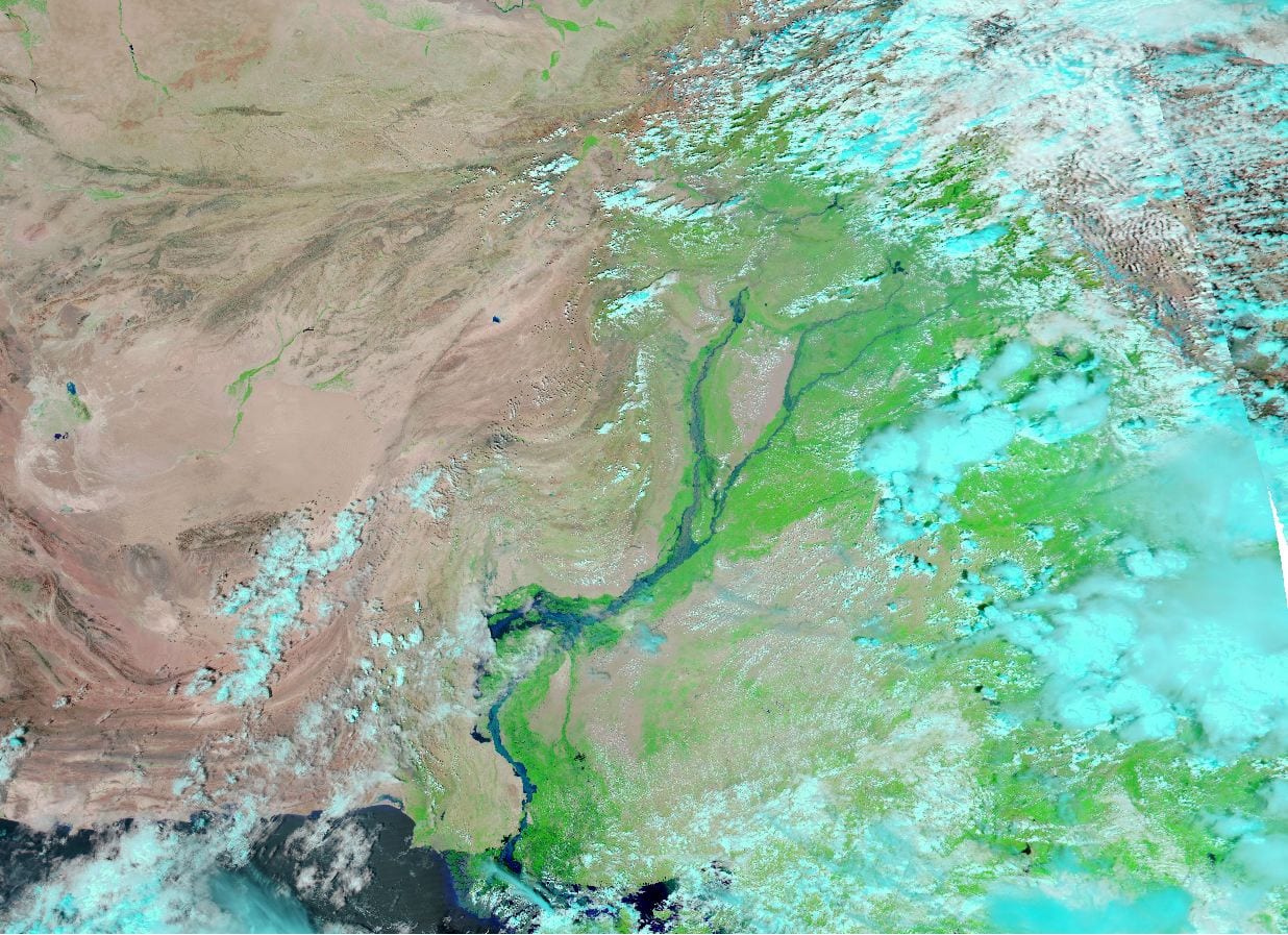 This MODIS image from 2010 shows the Indus River spanning well over 10 kilometers, completely filling the river valley, and spilling over onto nearby land. Floodwaters have created a lake almost as wide as the swollen Indus that inundates Jhatpat. Floods such as these are not uncommon in Pakistan.