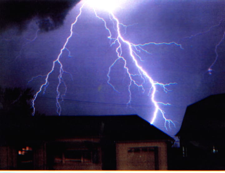 FIgure of a Lightning strike near house in Oklahoma. Photo credit: Tom Windsor /Windphoto.com