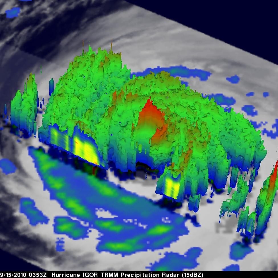 This 3-D image of Hurricane Igor's cloud heights and rainfall from NASA TRMM data shows a large area of heavy rainfall (falling at about 2 inches per hour), shown here in red on Sept. 15, 2010, at 0353 UTC. The yellow and green areas indicate moderate rainfall between 0.78 to 1.57 inches per hour. The image reveals that Igor's eye was still very distinct but the southwestern portion of the eye wall had eroded. It was located about 440 miles east-northeast of the Northern Leeward Islands in the Atlantic Ocean at this time. Credit: Credit: NASA/SSAI, Hal Pierce