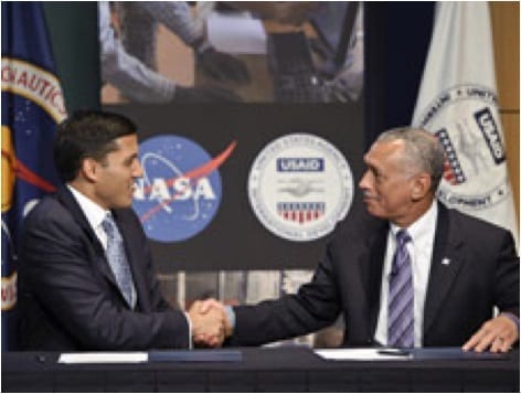 NASA's Charles Bolden and USAID's Rajiv Shah shake hands after agreeing to a 5-year memorandum of understanding. Photo Source: SERVIR