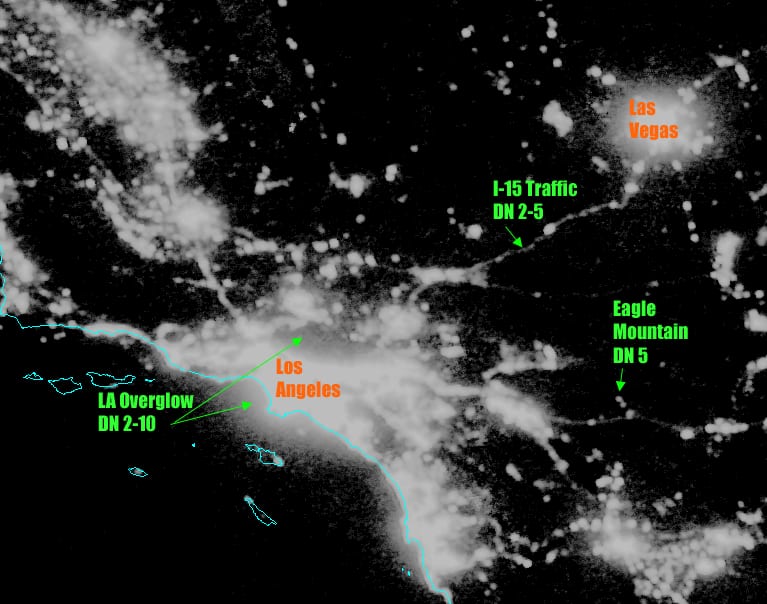 Figure 3. DMSP-OLS annual cloud-free composite of nighttime lights of the Los Angeles, California, region.  The image contrast has been enhanced to reveal dim lighting detected by the OLS sensor.  Note the overglow surrounding Los Angeles, extending more than 50 km offshore. The overglow arises from the OLS detection of dim lighting scattered in the atmosphere. Overglow digital number (DN) values exceed DN values for lighting from Interstate 15 highway traffic between LA and Las Vegas and many small towns.