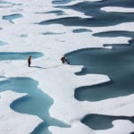 The sea ice atop the Arctic Ocean can—as shown in this photograph from July 12, 2011—look more like Swiss cheese or a bright coastal wetland. Image source: