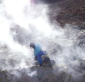 Photo of Uturuncu and steam rising around a person. Noah Friedman-Rudovsky for The New York Times