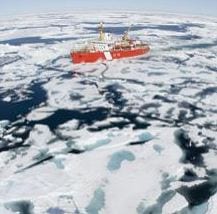 Image of the Actic covered in ice with an icebreaker ship moving along. (Image: Canadian Press/Rex Features)
