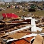 People and wreckage following Friday's tornadoes in the heartland. Credit Butch Dill / AP