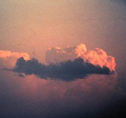 Image of a thunder cloud with a pinkish hue. Credit: NOAA