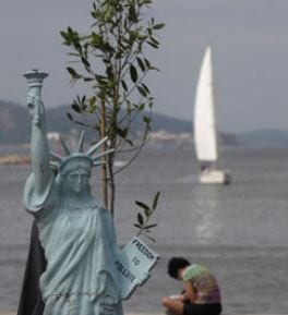 A model Statue of Liberty during the People's summit at Rio+20. Photograph: Ricardo Moraes/Reuters