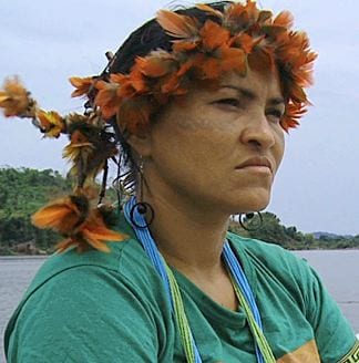 Image of a woman on the Xingu River, which is set to be dammed by Belo Monte dam project.