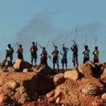 Line of fire: Amazon Indians protest against the massive Belo Monte hydroelectric dam. Photograph: STRINGER/BRAZIL/REUTERS