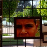 Photo of a child reflected in a mirror. Photo credit: adaptingtoscarcity