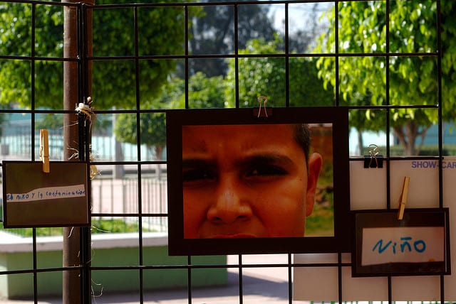 Photo of a child reflected in a mirror. Photo credit:  adaptingtoscarcity