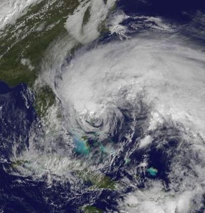 Visible image of Hurricane Sandy from NOAA's GOES-13 satellite on Friday, Oct. 26 at 1415 UTC (10:15 a.m. EDT) and shows Hurricane Sandy's huge cloud extent of up to 2,000 miles while centered over the Bahamas, and the line of clouds associated with a powerful cold front approaching the U.S. east coast. (Credit: NASA GOES Project)