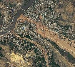 his detailed image, from DigitalGlobe's WorldView-2 satellite, shows the largest slide in the lower part of the city on Aug. 10, 2010. Credit: Image from WorldView-2 2010 by DigitalGlobe.