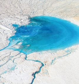 Photo: The Asahi Shinbun/Getty Images GREENLAND BLUES: Sensors are spying signs of climate troubles, such as this glacial lake in Greenland. 