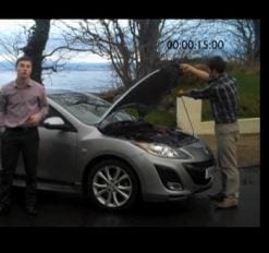 Screenshot of students with their hybrid car. Credit: New Scientist