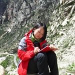 During a field trip in Tibet, Qiuyun Li writes notes for her research on porphyry copper deposits in post-collisional settings. Image Credit: Qiuyun Li