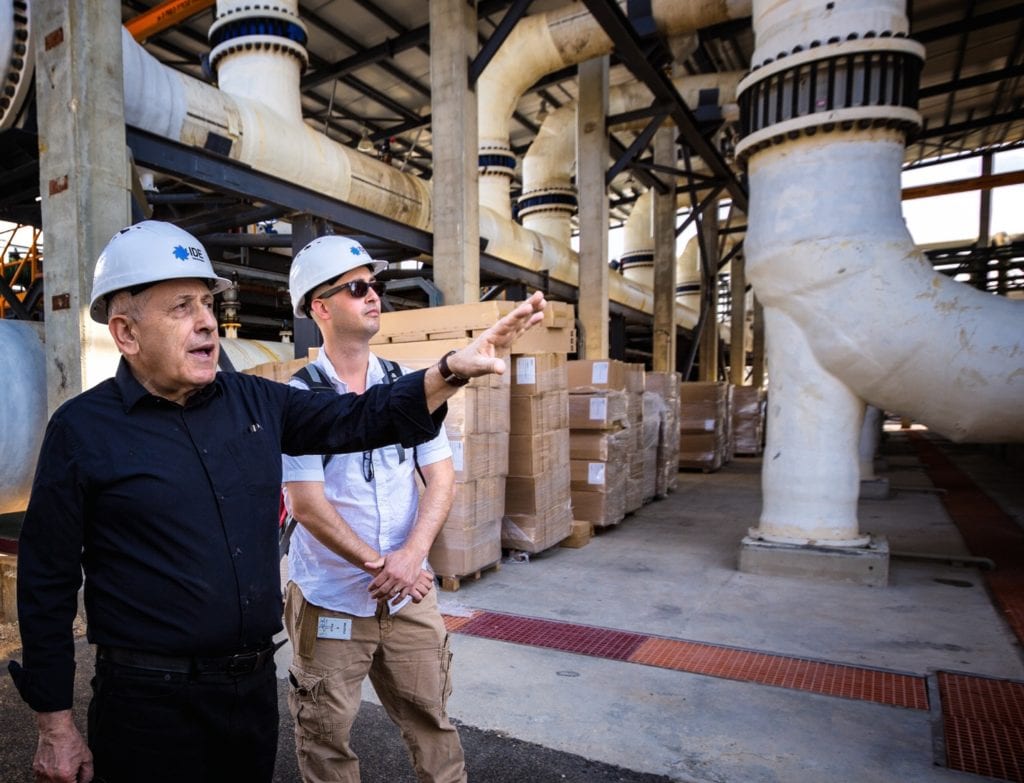 Ben-Gurion University of the Negev water researcher Edo Bar-Zeev (right) at the Sorek Desalination Plant with plant owner Boris Liberman, chief technology officer at IDE. Image Credit: Osha Gray Davidson 