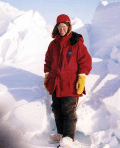 Parkinson standing next to a ridge of ice in the central Arctic, on a NASA expedition to the North Pole, April 1999. Image Credit: Elizabeth Arnold 