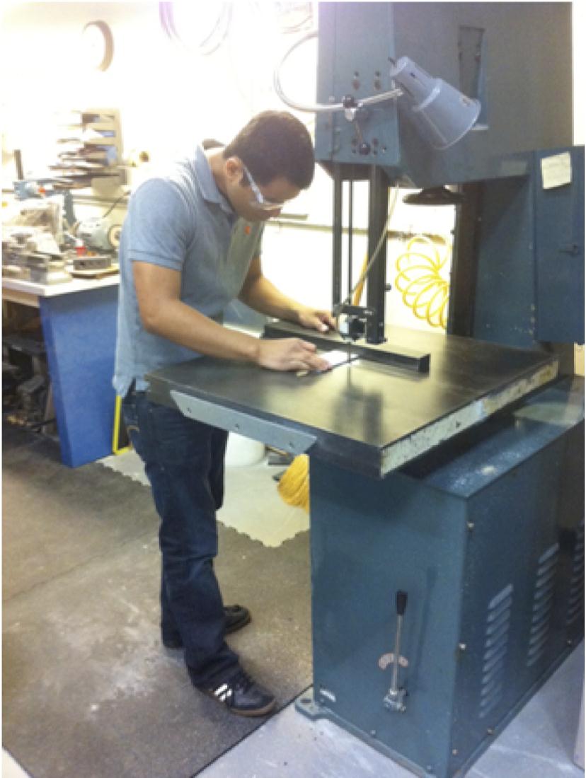 Mechanical engineering student Juan Barragan works to manufacture a propellant tank baffle support. Image Credit: URC.