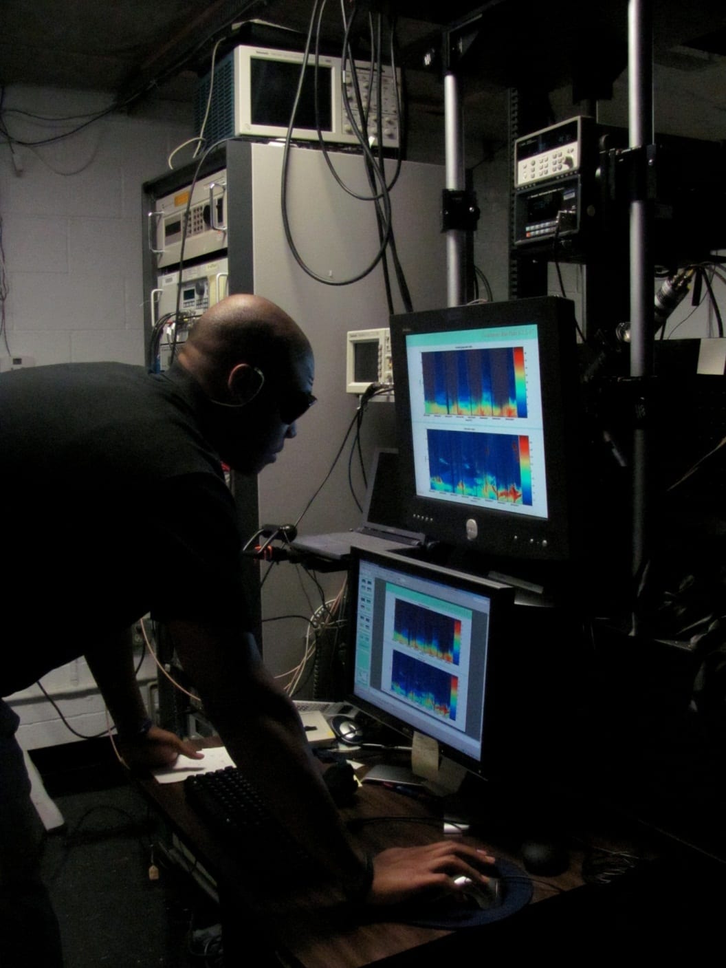 Photo of Stanford Carter reviewing data captured on the HURL Raman Lidar at the Howard University Beltsville Center for Climate System Observation. Image Credit: URC.