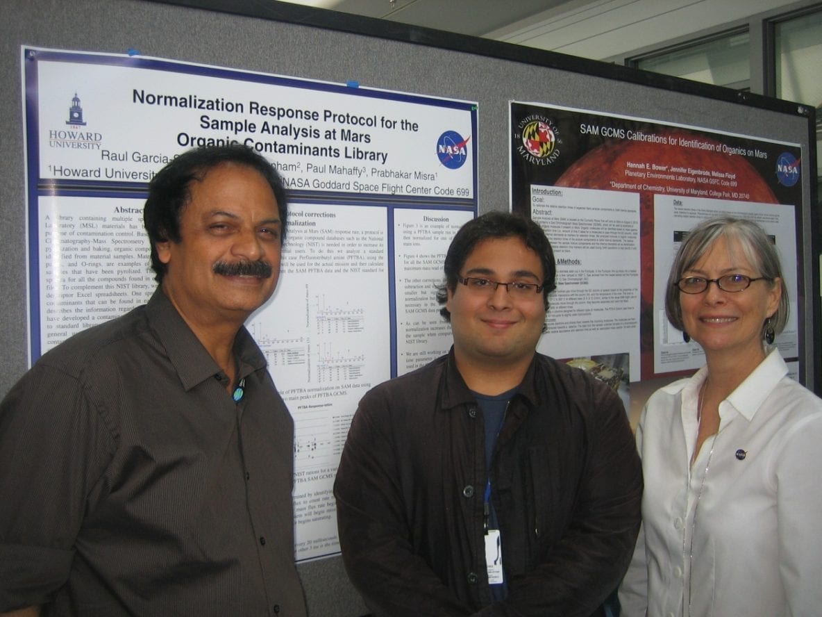Raul Garcia-Sanchez and Dr. Prabhakar Misra with a model of the Sample Analysis at Mars (SAM) instrument for the Mars Science Laboratory (MSL) mission. Image Credit: URC.