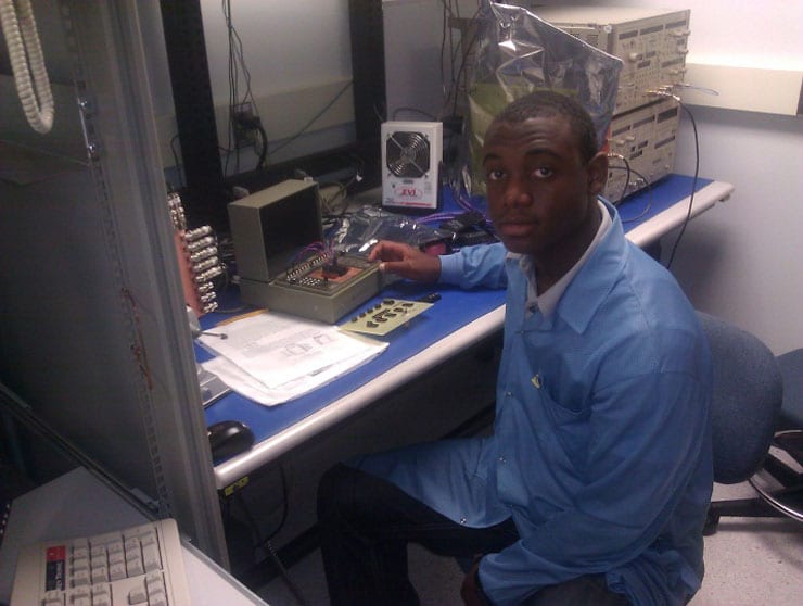 Intern Brandon Norman tests the op amp after taking it out of the radiation chamber of the Keithley 4200 and HP test fixture. Image Credit: URC.