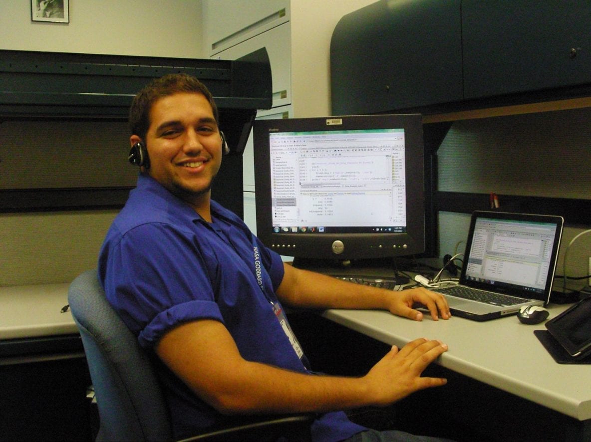 Rigoberto Roche makes changes to improve output statistics and provide high quality graphical representations of the analyzed data produced during his internship at NASA Goddard Space Flight Center. Image Credit: NASA/Dr. Ali Tokay.