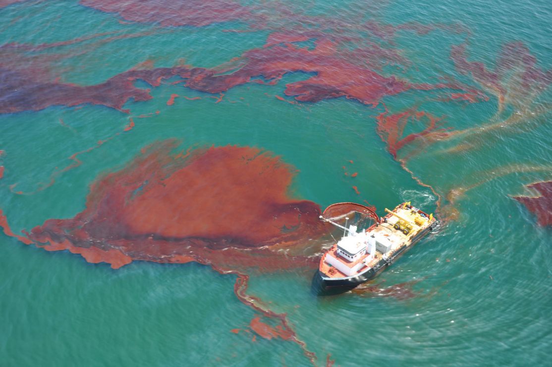 A vessel of opportunity skims oil spill