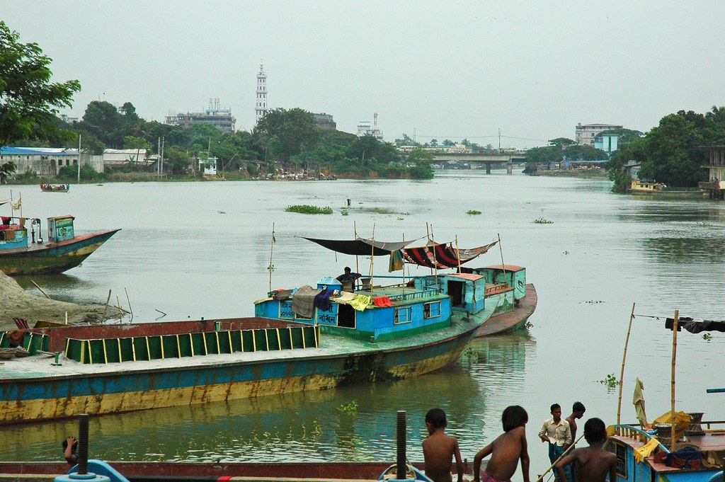 "Boats and people on the Turag River, Dhaka, Bangladesh"