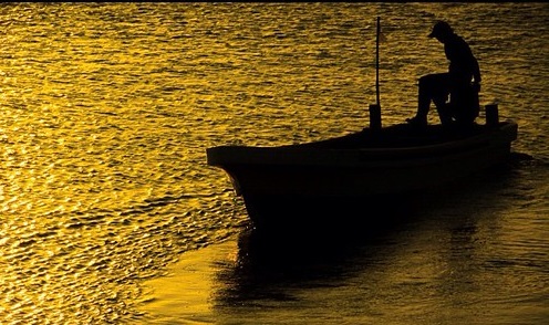 A fisherman at sunset